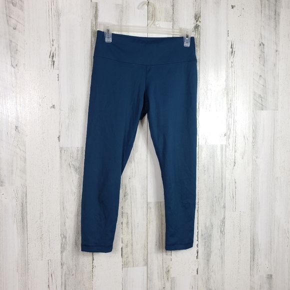 Yogalicious dark teal capri leggings with criss cross cut outs size small - Picture 1 of 10
